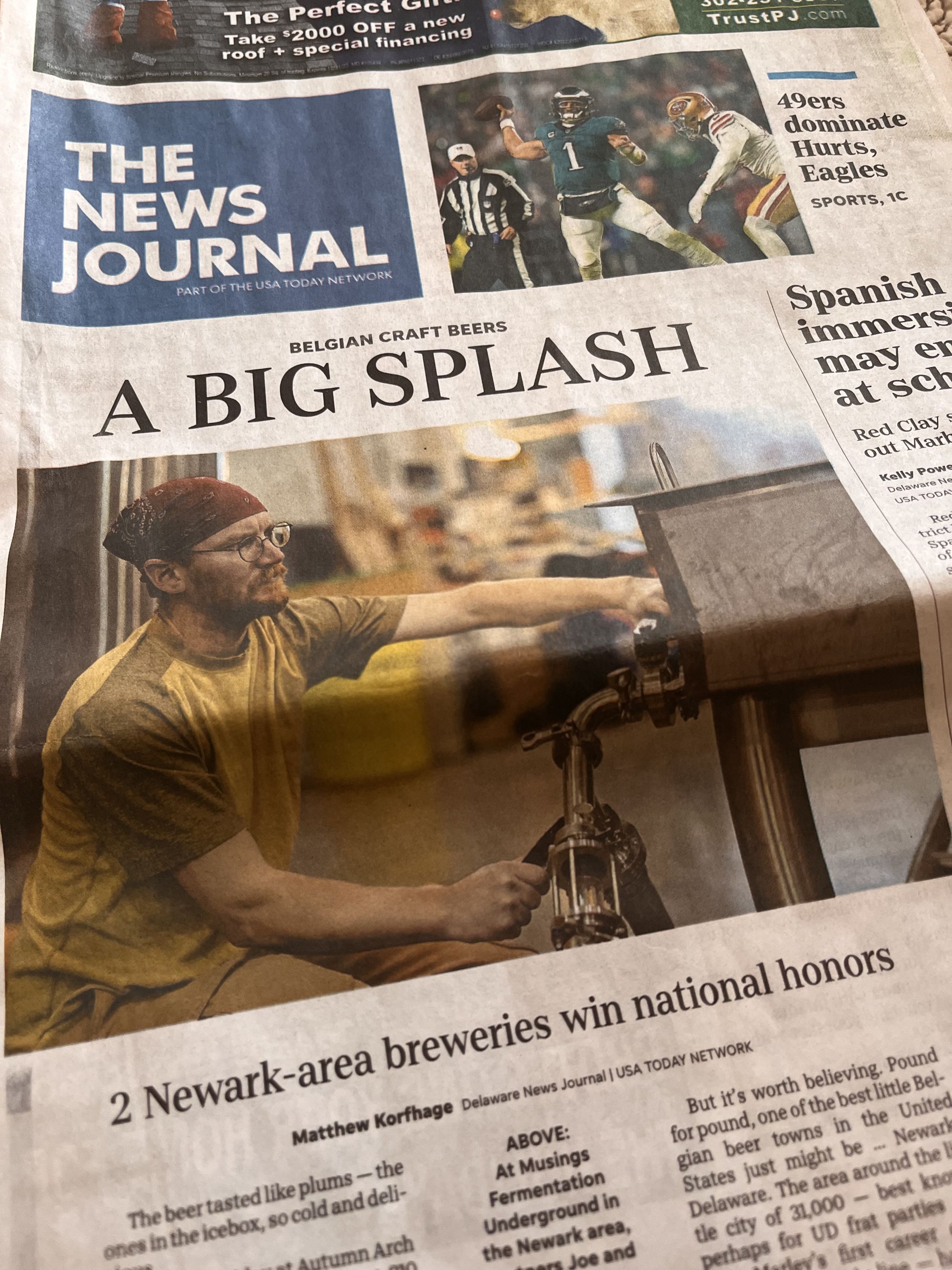 image of the News Journal with Joe Jasper on the front page. Joe is working with brewing equipment in this photo.